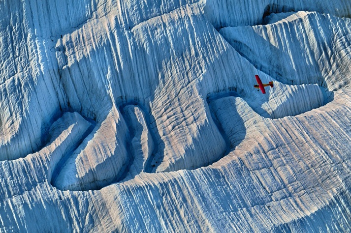 An aeroplane over an Alaskan glacier